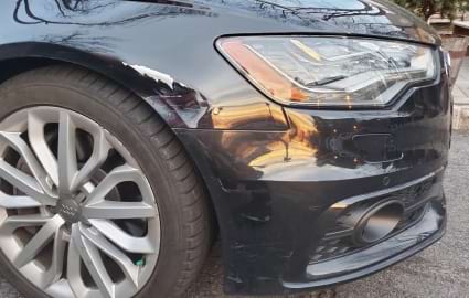 Image of car with fender damage